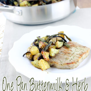 Creamy buttermilk, garlic, and herbs top juicy pork chops and vegetables to create the perfect One Pan Buttermilk and Herb Pork Chop and Vegetables. | EverydayMadeFresh.com