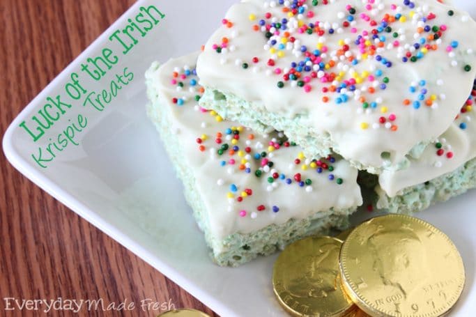 Luck of the Irish Rice Krispie Treats are green, topped with white chocolate, and covered in rainbow sprinkles. These are perfect St. Patrick's Day Rice Krispie Treats! | EverydayMadeFresh.com
