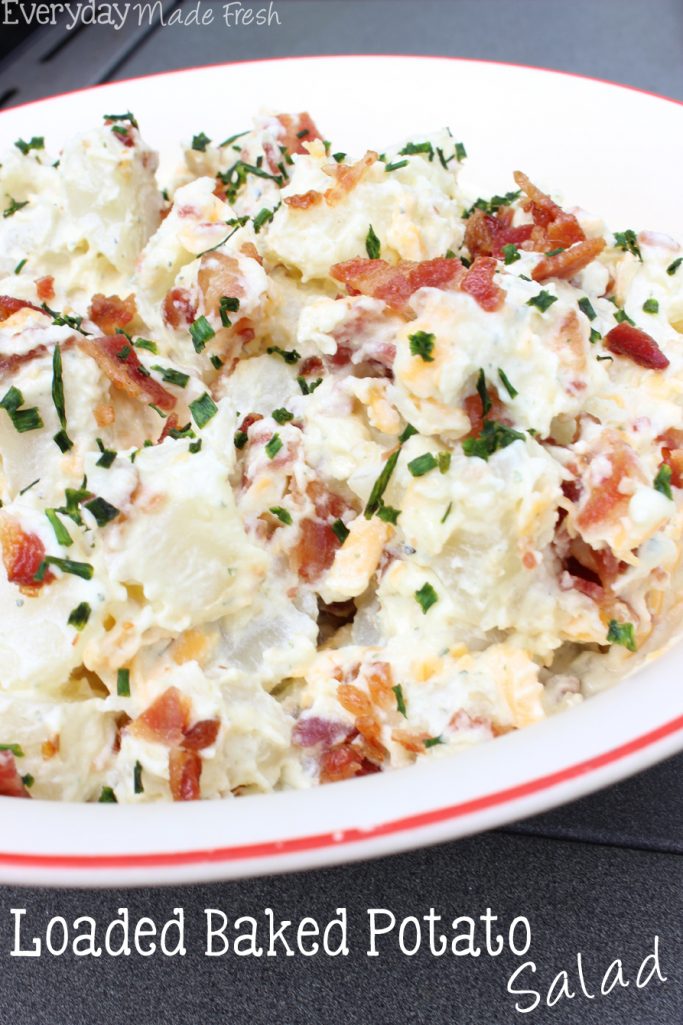 This Loaded Baked Potato Salad is made with a creamy ranch dressing, crunchy bacon pieces, cheddar cheese, perfectly cooked potatoes, and topped with chives! It's the perfect side to your next BBQ. | EverydayMadeFresh.com