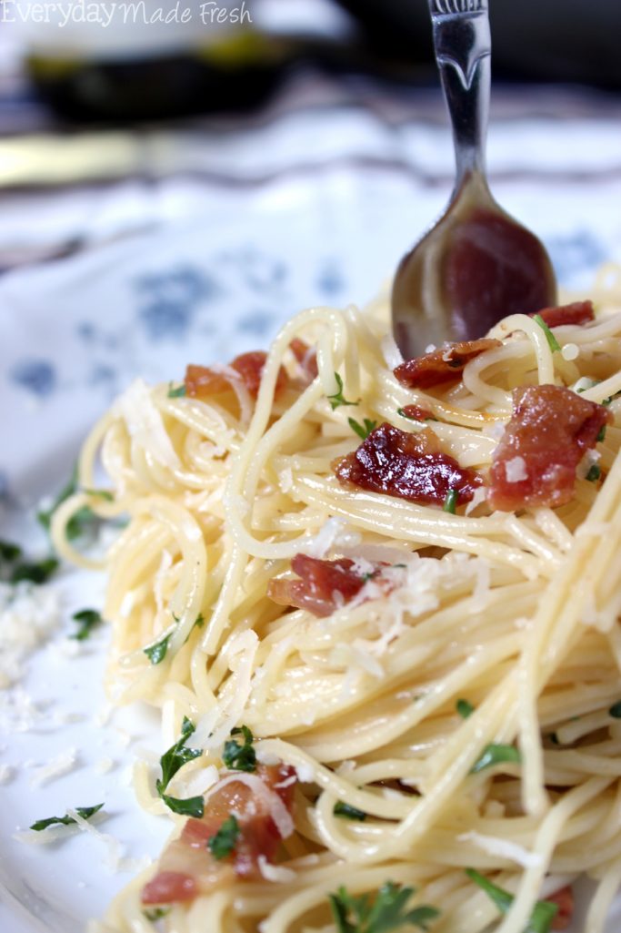 Spaghetti Carbonara is a fancy sounding pasta dish that is simple to prepare. Ready in less than 25 minutes, and requires literally a handful of fresh ingredients.  | EverydayMadeFresh.com