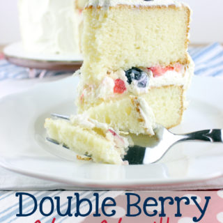 Nothing says summer time like blue berries and strawberries...And nothing says summer like a red, white, and blue dessert. This Double Berry Very Vanilla Cake is all of that! It's made light with the perfect whipped cream cheese topping.  | EverydayMadeFresh.com