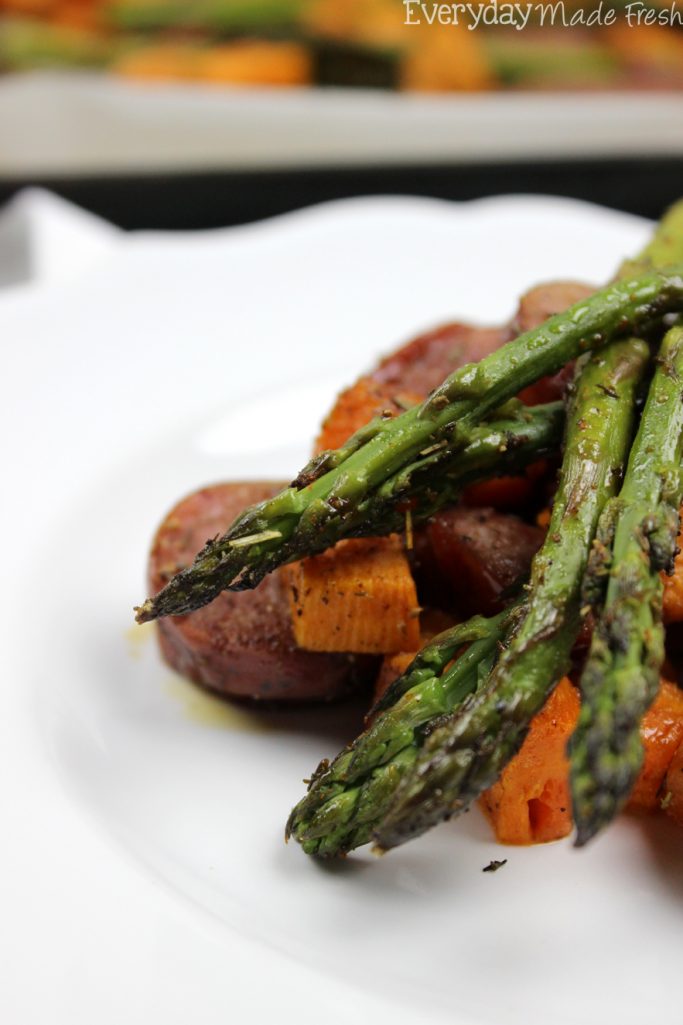 This Sheet Pan Sausage, Asparagus, and Sweet Potato is ready in less than 20 minutes. Flavor packed with herbs, it's a healthy meal that is perfect any night of the week. | EverydayMadeFresh.com