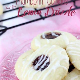 Buttery and soft, sweet and tart, these cookies have it all! These Raspberry Thumbprint Cookies with Lemon Drizzle are simple to make and perfect for any occasion! | EverydayMadeFresh.com