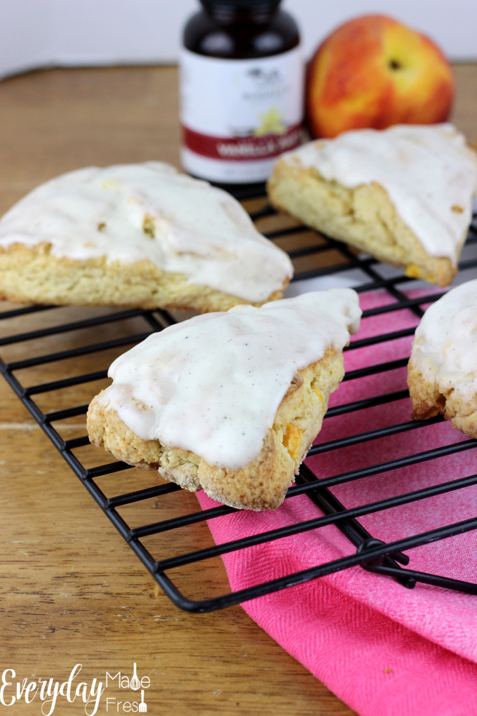 Nothing says summer like fresh peaches - and these Fresh Peach Scones & Vanilla Bean Glaze are the perfect summer breakfast or sweet treat! | EverydayMadeFresh.com