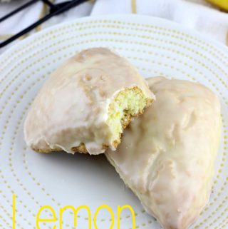 Lemon Scones are light and fluffy, bursting with lemon flavor! They are dipped in a lemon glaze that make these the perfect breakfast or snack. | EverydayMadeFresh.com