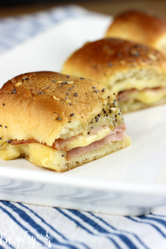 These Ham & Gouda Sliders are crowd pleasers. Melty gouda cheese and juicy ham come together with a buttery poppy seed topping that is simply amazing. | EverydayMadeFresh.com