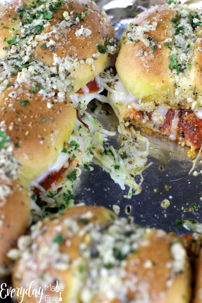 Sliders are popular for all sorts of reasons, and their small size make them fun for parties, get together, and holidays.  These Pizza Sliders are cheesy and totally customizable, and loved by all! | EverydayMadeFresh.com