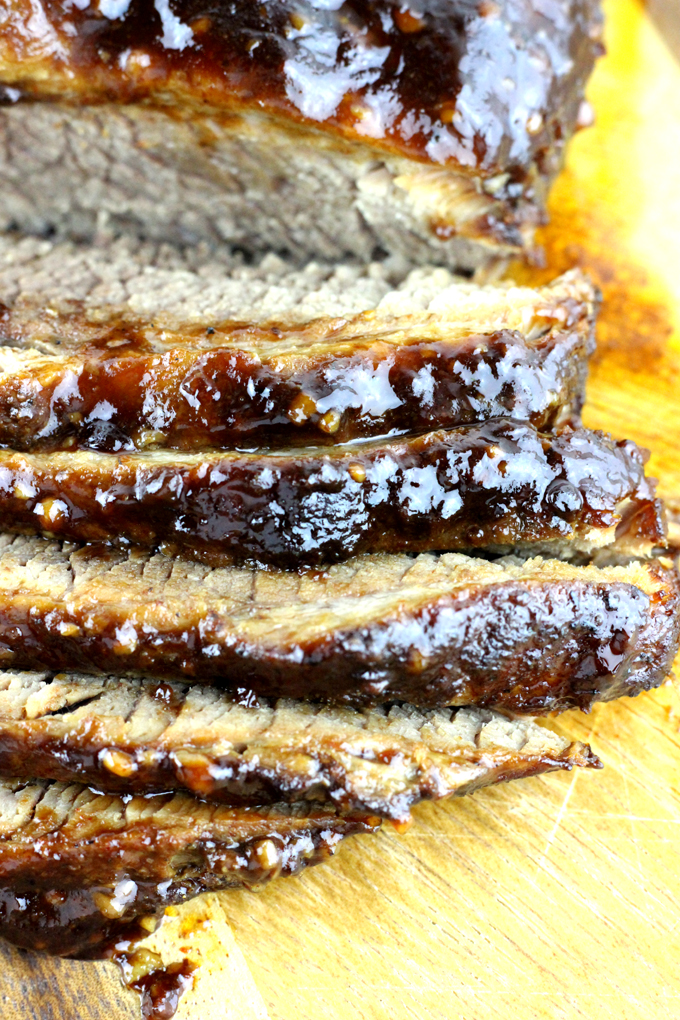 This juicy beef brisket recipe is easy to make - rubbed in a delicious dry rub and then smothered in barbecue sauce. I'll show you how to make the best beef brisket!