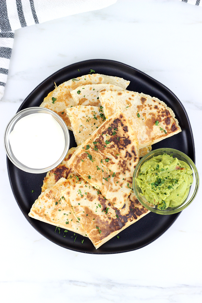 These Spicy Cheesy Chicken Quesadillas are loaded with chicken, shredded cheese and have a with a spicy jalapeno sauce that make these the best homemade quesadillas ever!
