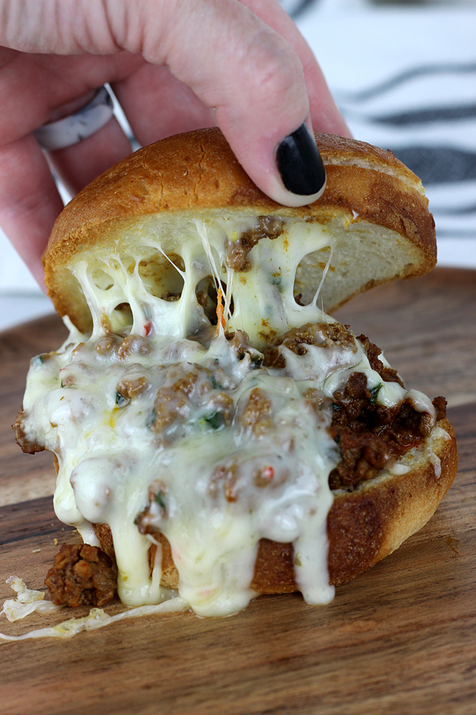 This is not your typical sloppy joe recipe! These Cheesy Enchilada Sloppy Joes have a tasty tex-mex twist that your family will love.