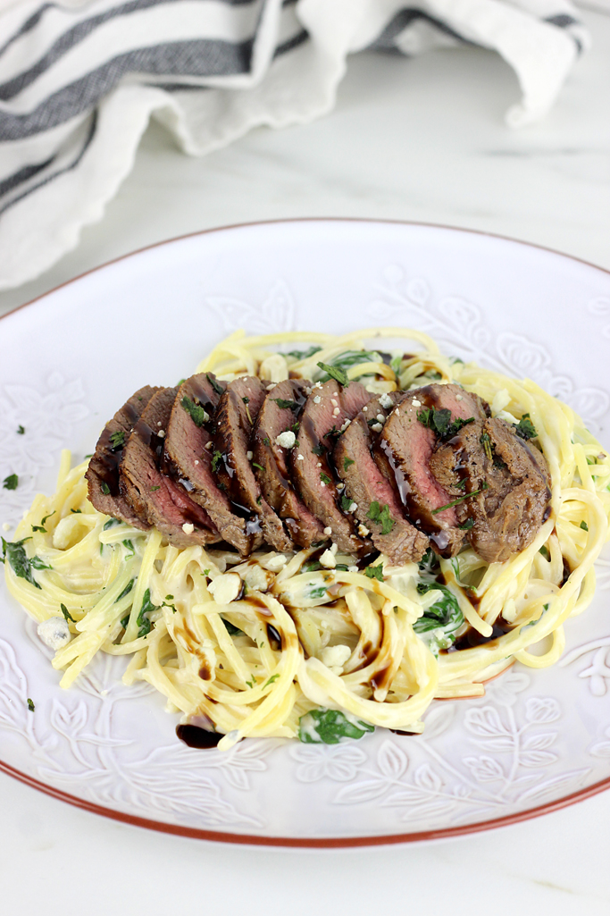 Everything you know and love about the original- This Steak Gorgonzola Alfredo - Olive Garden's Copycat is easy to recreate at home. This recipe features slices of steak in a creamy gorgonzola sauce with fresh spinach, topped with a balsamic glaze that is out of this world delicious!