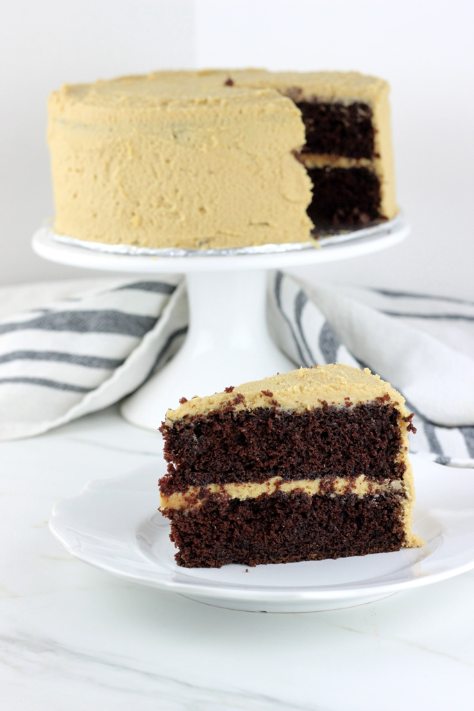 Moist and decadent chocolate cake, smothered with the creamiest peanut butter frosting. The best part is, this is the best chocolate cake with peanut butter frosting!